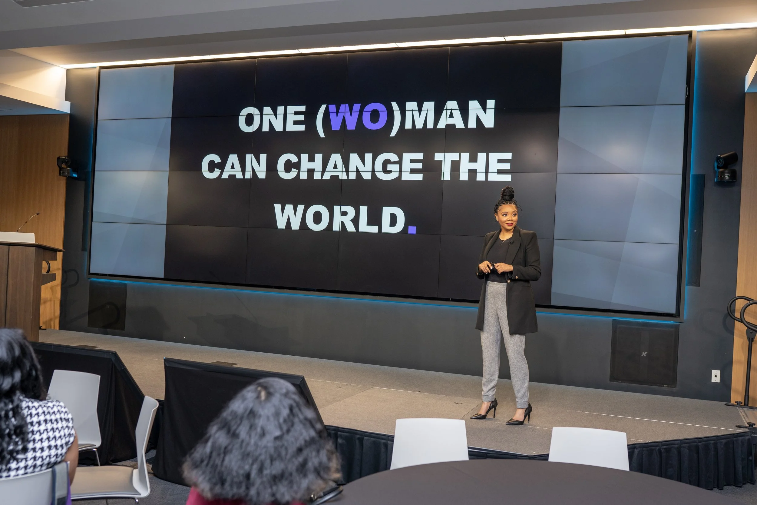 Sheena Allen speaking on stage in Washington, D.C. at conference about entrepreneurship and women empowerment