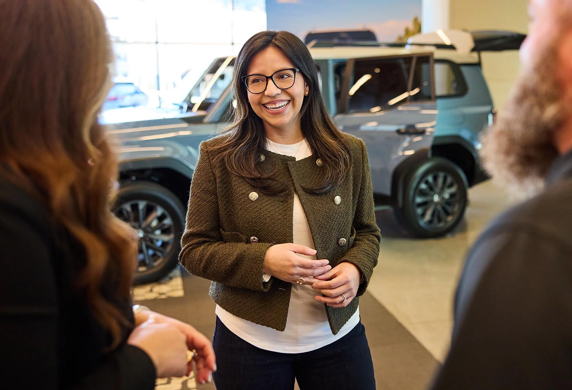 Corporate photography in Dallas of a woman talking in a Toyota showroom