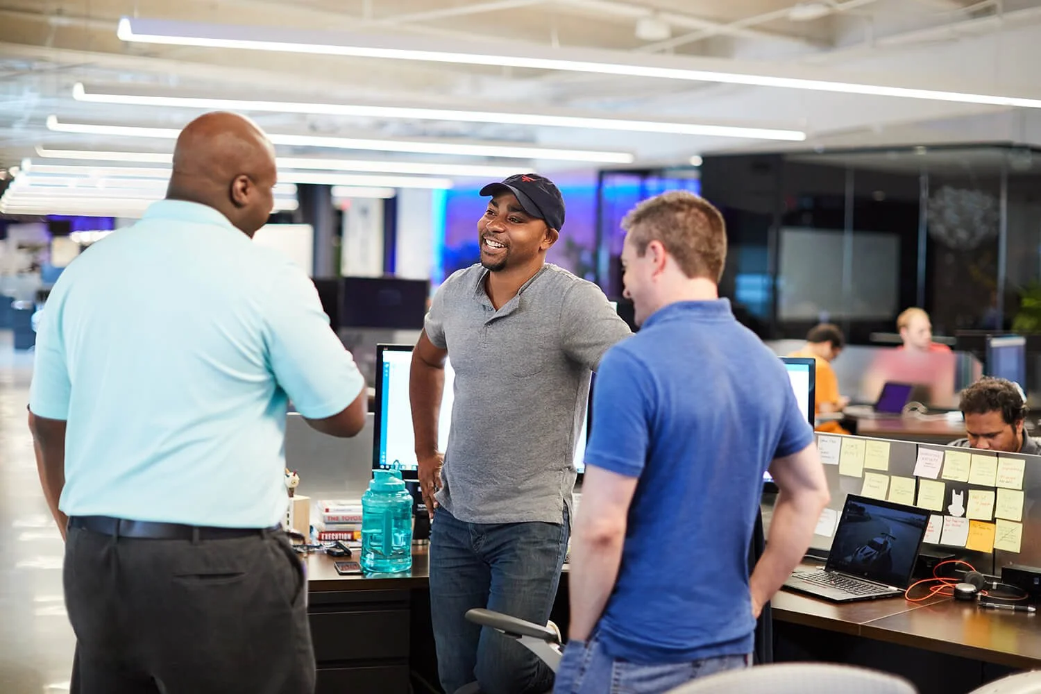 Dallas corporate photography showcasing dynamic office interactions.