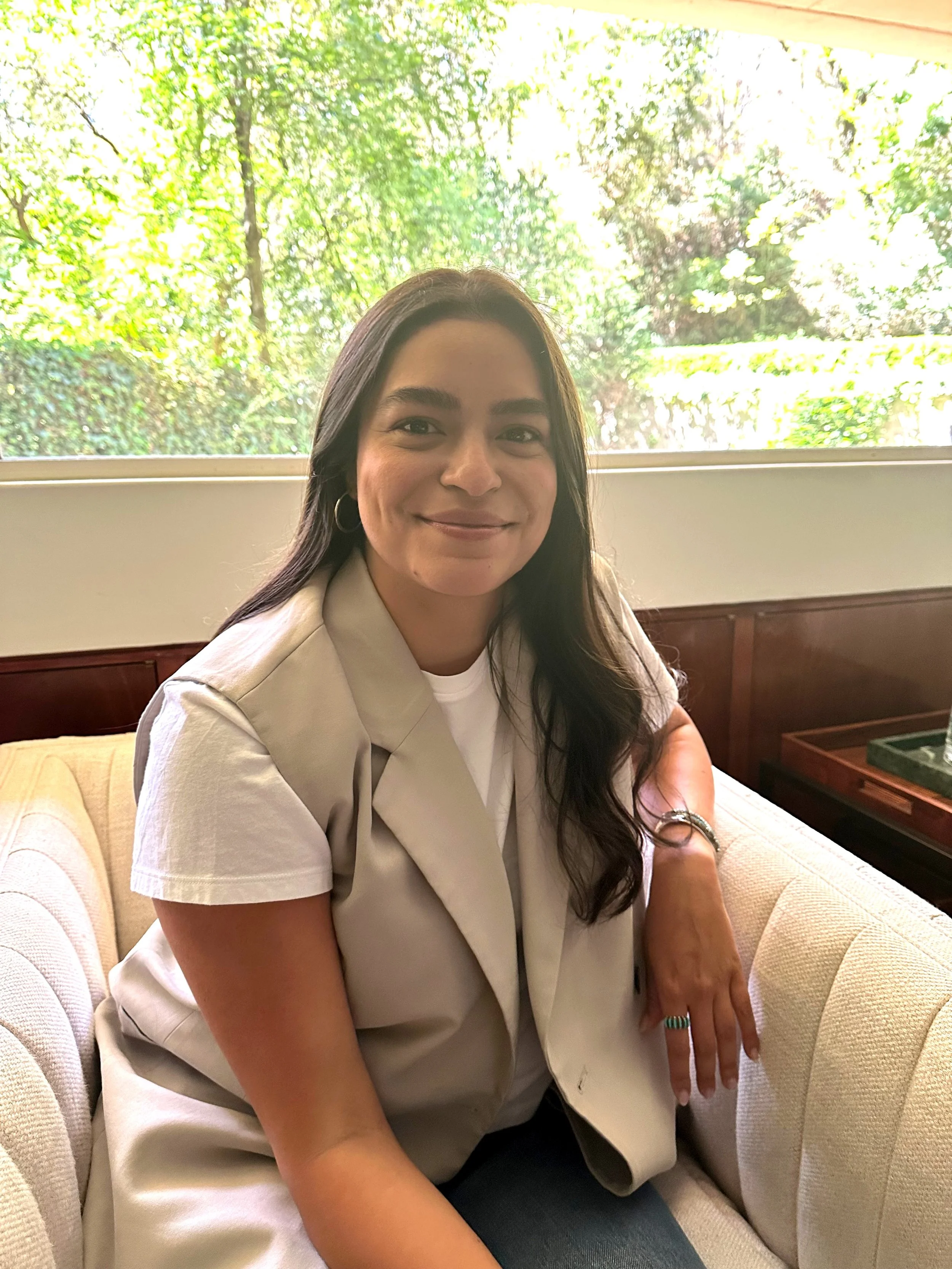 photo of the therapist on a light couch