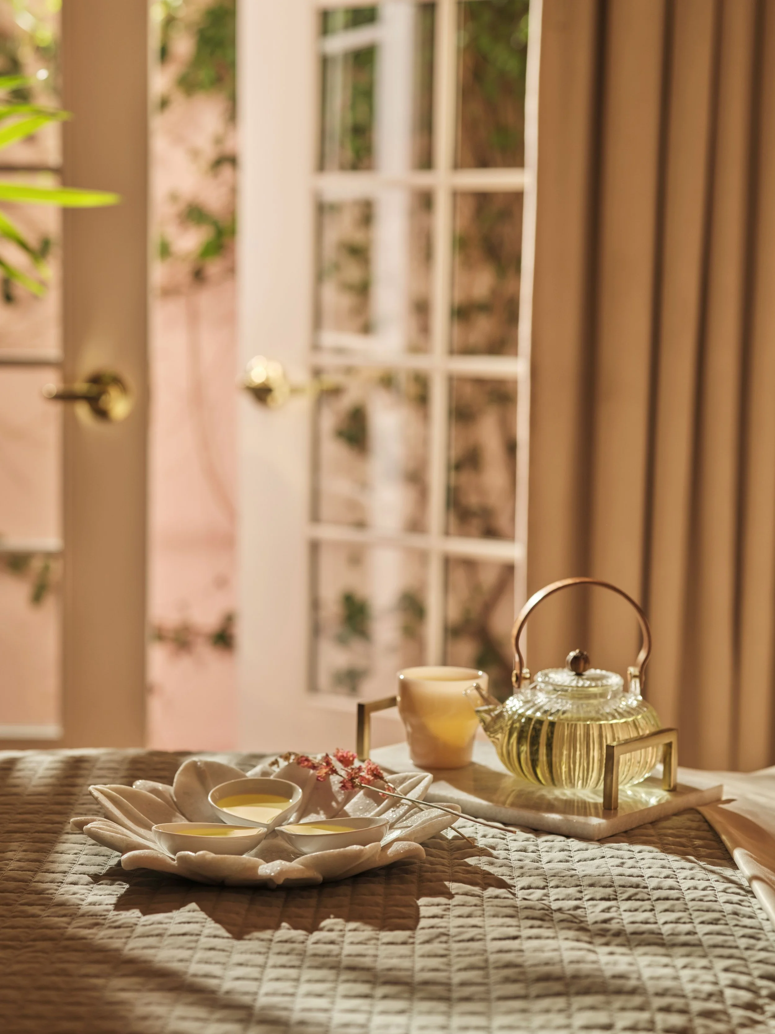 Hotel Bel-Air-Spa-couples treatment room-moment-treatment oils on bed-tea set-up-DorchesterCollection (3).jpg