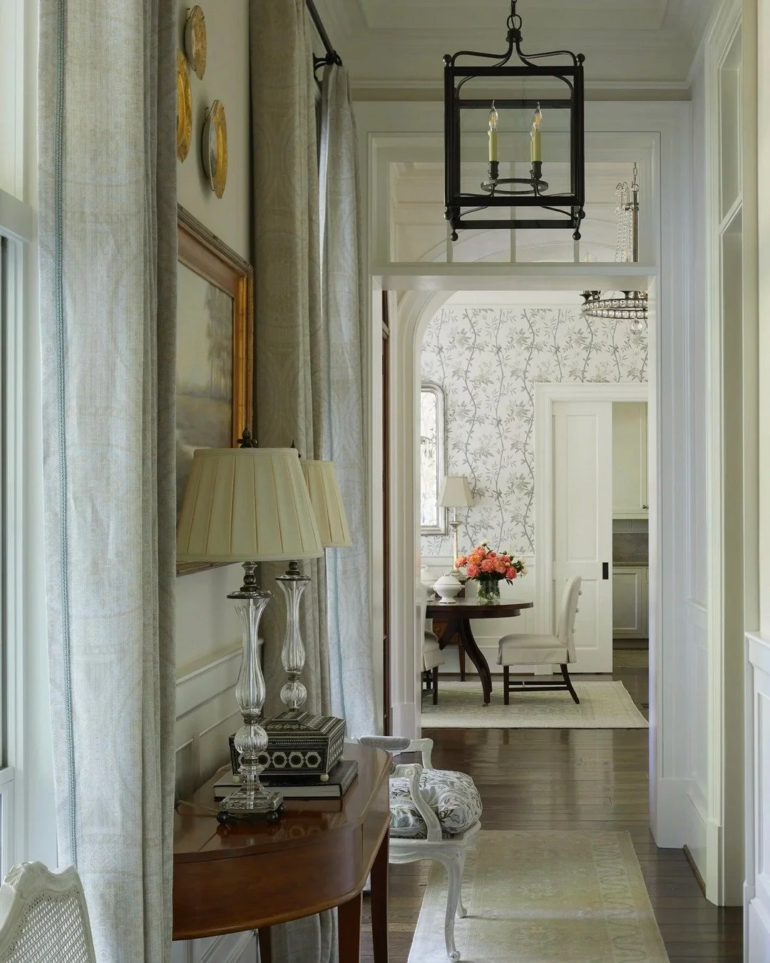 A layered hallway that tells a story&mdash;antique finds meet custom pieces to create timeless space. From lamps to drapery to antique console, every detail is curated to balance sophistication with a collected feel.

photo: @lukerphotography
archite