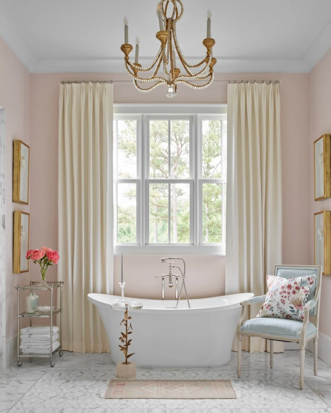 A primary bath designed for these clients with serenity and sophistication in mind. Soft blush walls, marble floors, and a sculptural soaking tub create a true retreat. Gilded details and accents add some depth&mdash;every element thought through!

p