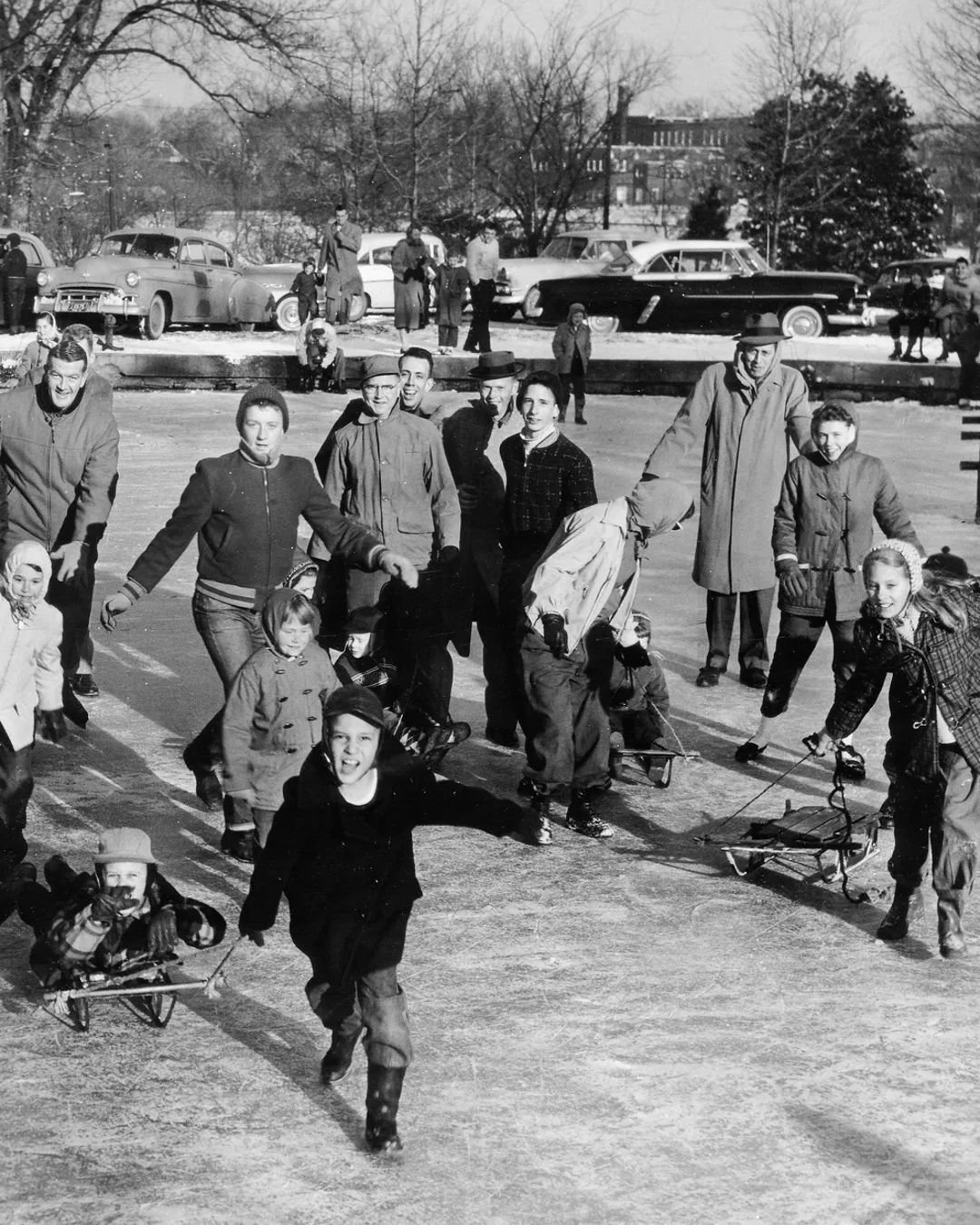 "Ice skaters, friends and spectators, crowded the lake at Centennial Park Feb. 17, 1958, as sparkling sunshine, stinging temperatures and a 4-inch crust of ice made it a perfect day for skating. Hundreds of cars packed the park at the height of 