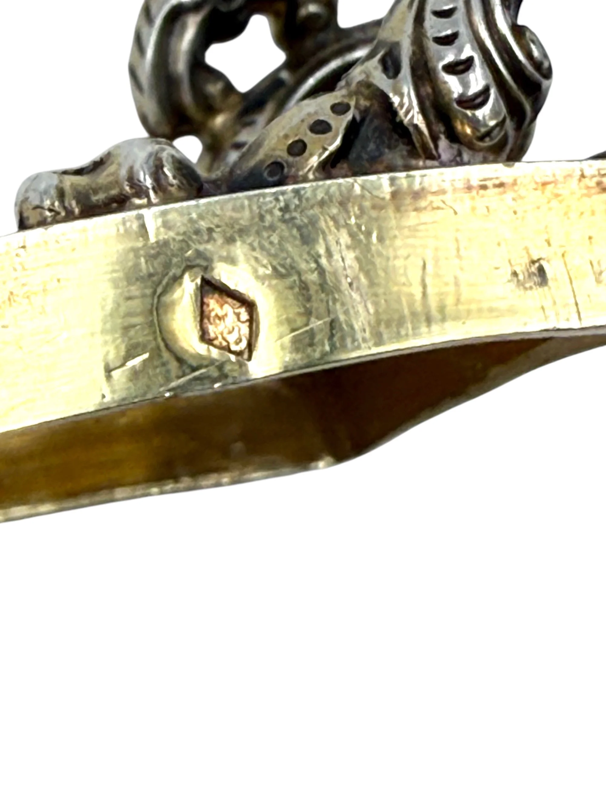 Open view of antique French silver vermeil pistol shaped cigarette box interior