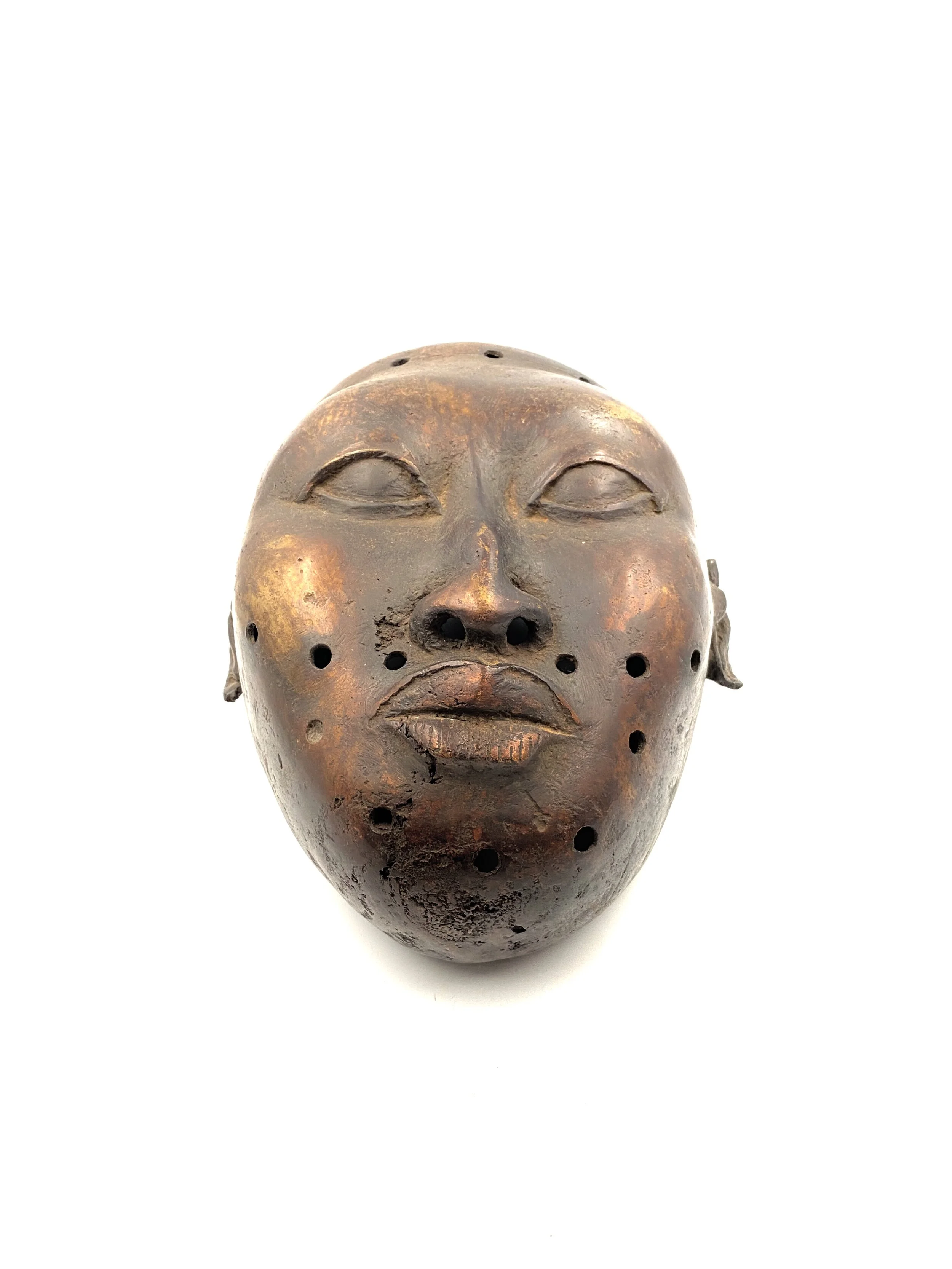 Trophy head of a foreign ruler, bronze, Benin Kingdom, early XX ce.