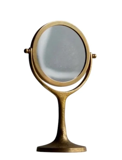 Mid-century French hammered brass table mirror and vanity mirror from the 1960s, showing textured metallic artisan details and a retro round design.