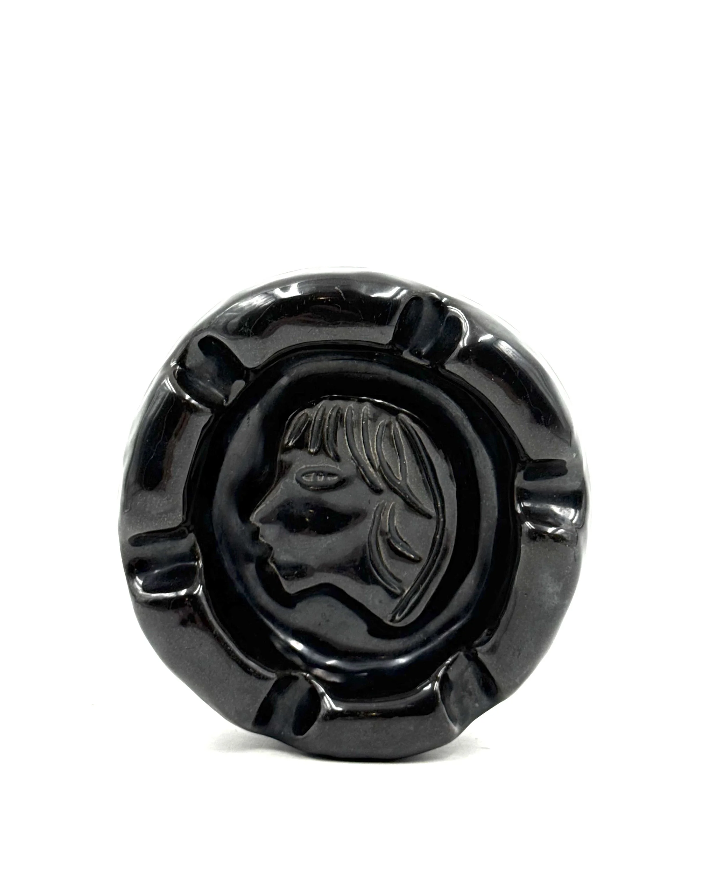Mid-century black glazed ceramic ashtray by Accolay, France from the 1960s, featuring organic textured details and a deep glossy metallic finish.