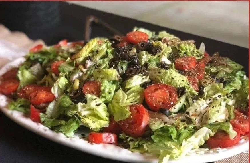 Italian chopped salad with tomatoes and olives