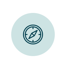 Icon of a compass on a teal circle background