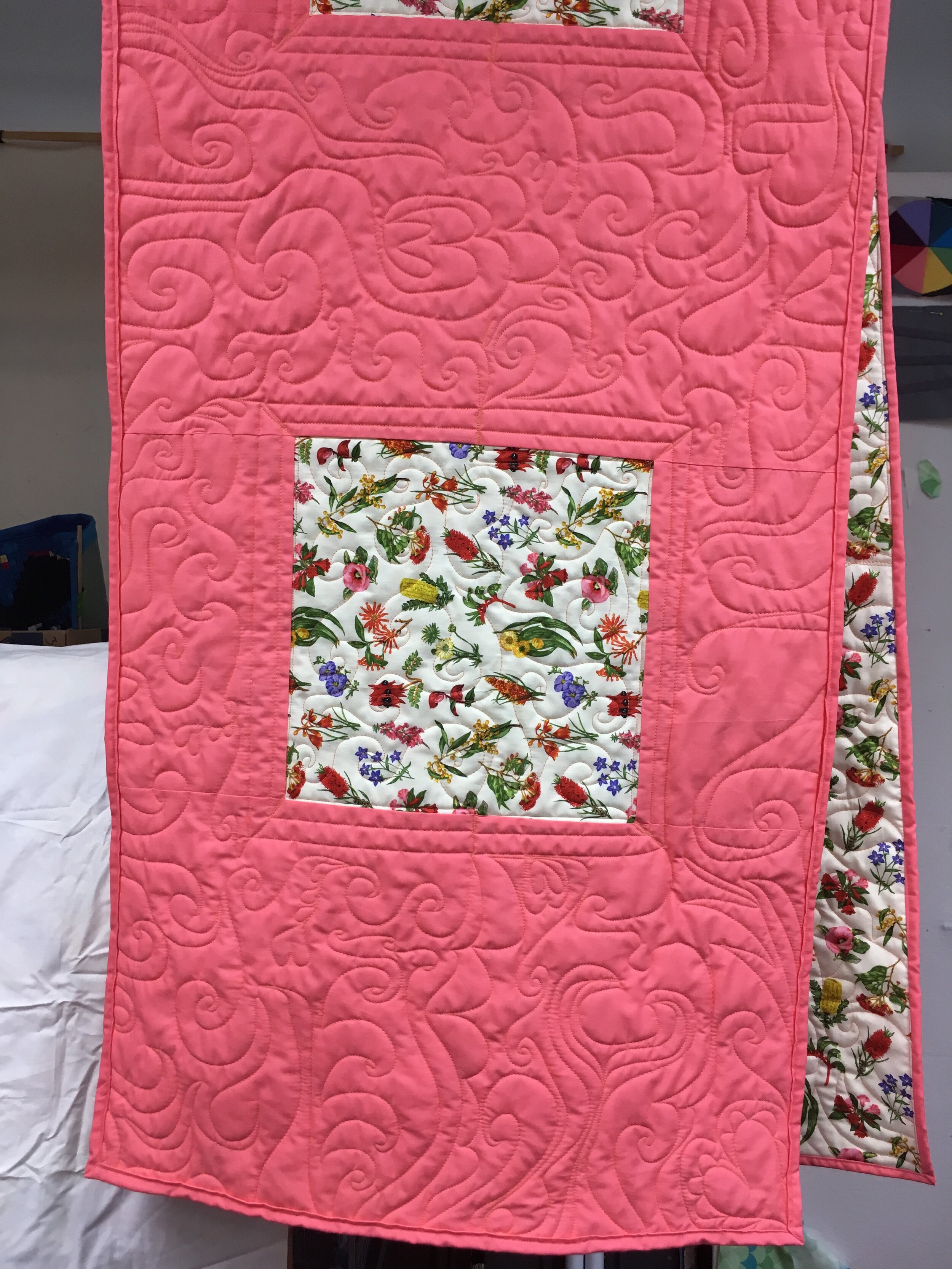 specially chosen Australian plant fabric and a rose base with intricate quilting to use as a bed runner
