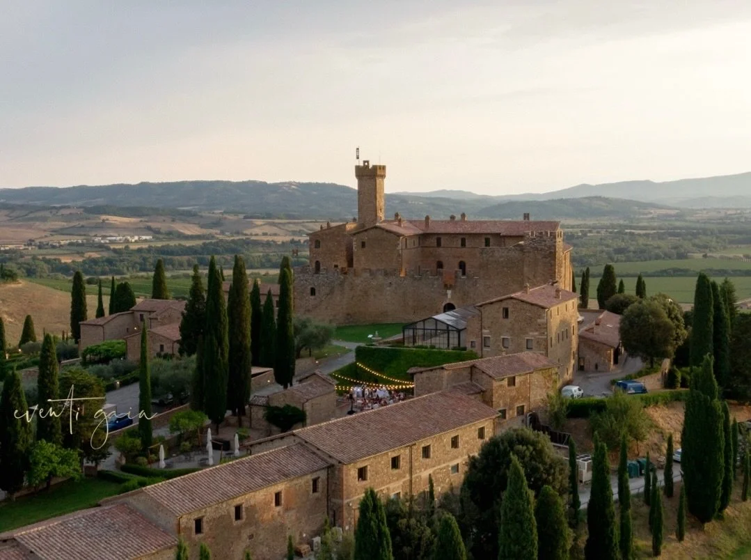 There&rsquo;s a stillness to Montalcino when viewed from above, a quiet dialogue between architecture and landscape. The medieval walls, the linear sweep of the cypress grove, the gentle curve of distant hills&mdash;all held together by the warm glow