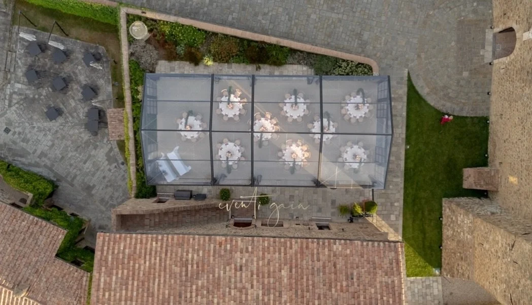 A transparent tent, a timeless setting 🤍
Like sitting inside a window carved into Tuscany &mdash; stone below, sky above, hills all around.
Here, the view doesn&rsquo;t frame the moment&hellip; it becomes it.

#eventigaia #excluisvewedding #destinat
