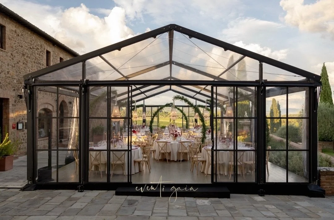 A tent is often the perfect frame for your dinner ✨
Glass walls, open skies, and the landscape becoming part of the experience &mdash; not just the backdrop, but the soul of the evening.

#eventigaia #excluisvewedding #destinationwedding #weddinginit