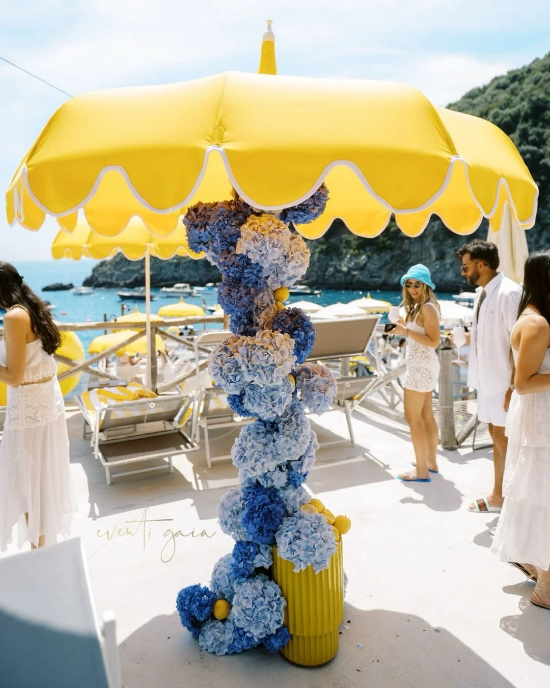 It&rsquo;s never just an umbrella. ☀️💛
We designed and personalised every parasol in our signature yellow, repeating the same colour across the towels, bar counter and countless other details. The result? A beach club setup where every element felt 