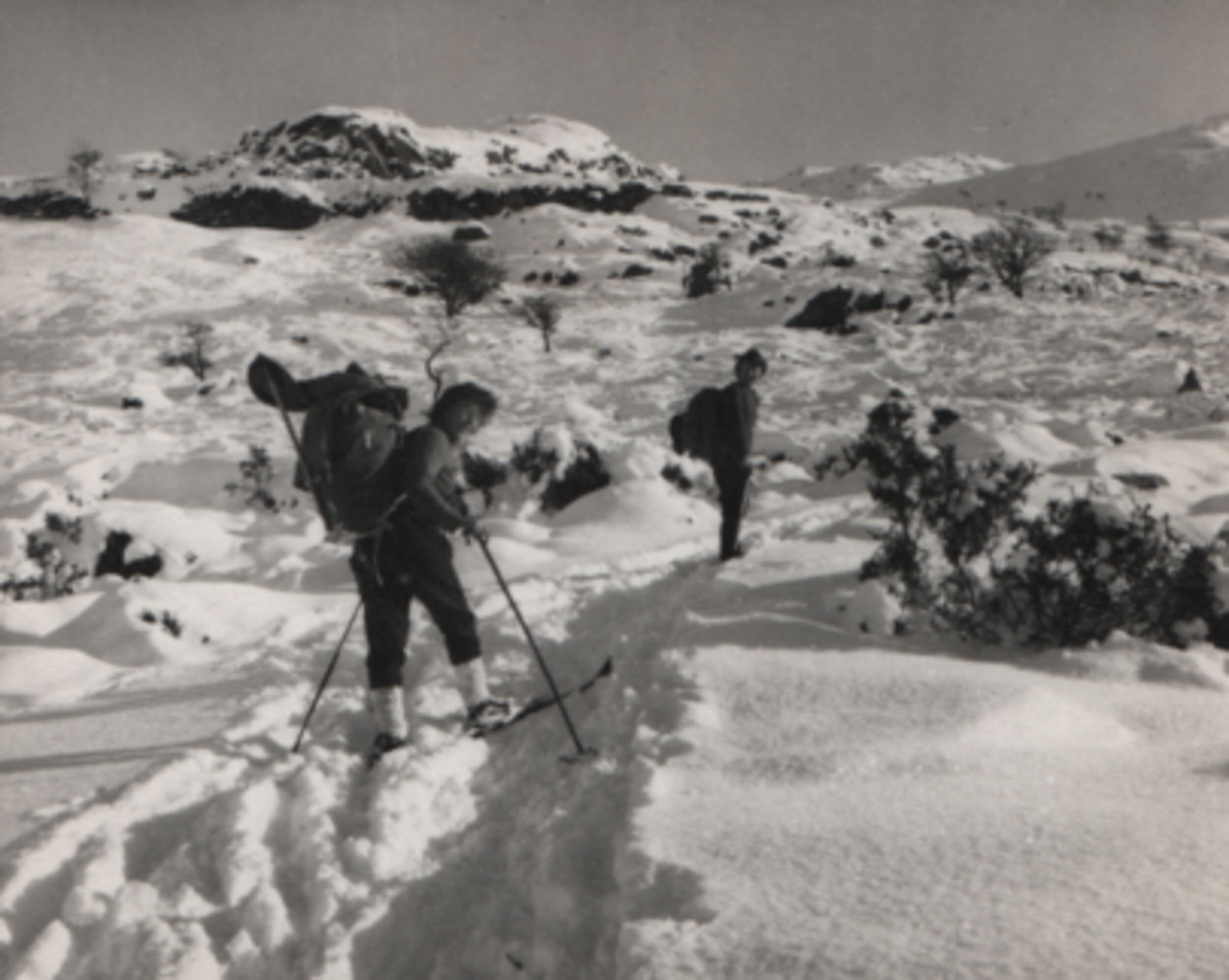 Nancy Smith and others skiing out of the hut - Cwm Dyli, North Wales, 1962