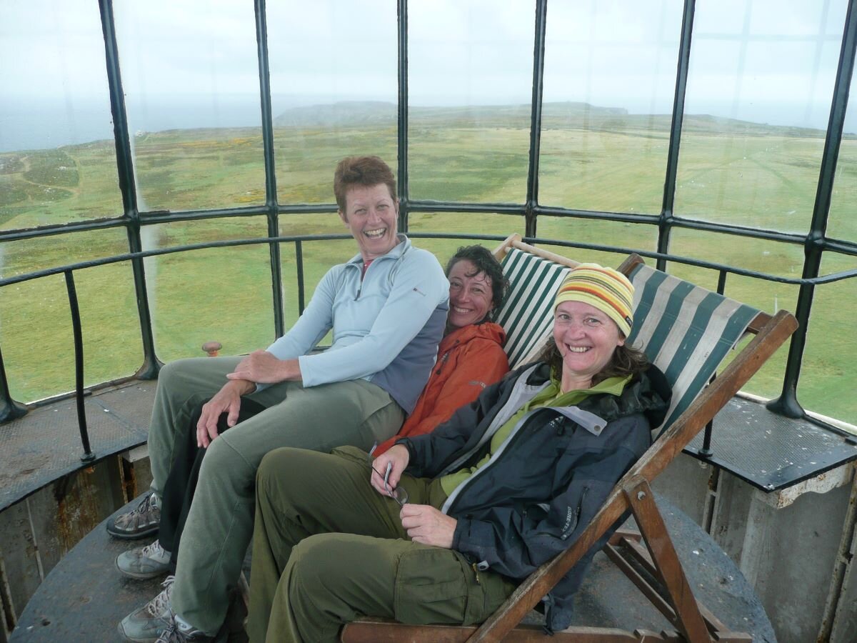 Alison Cairns, Hilary Lawrenson and Margaret Best  chilling out of the rain in the Lighthouse, Lundy, in 2011