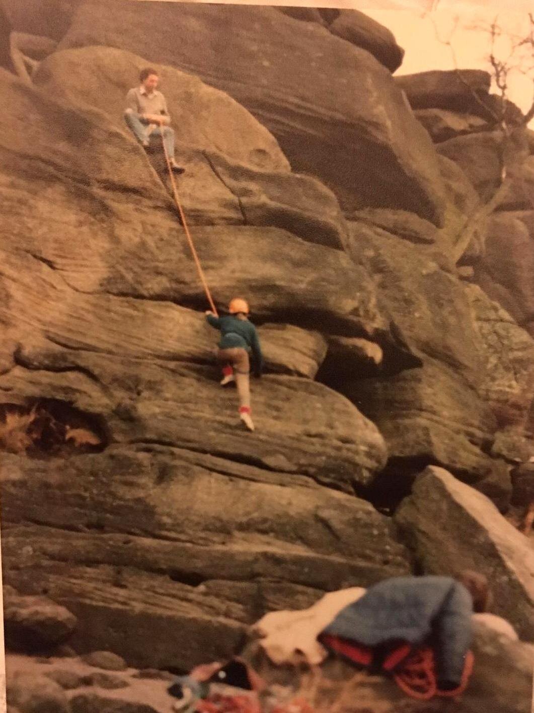Jo seconding a route on a university club meet in 1983. Note plimsolls, and belt and sling leg loops instead of a harness