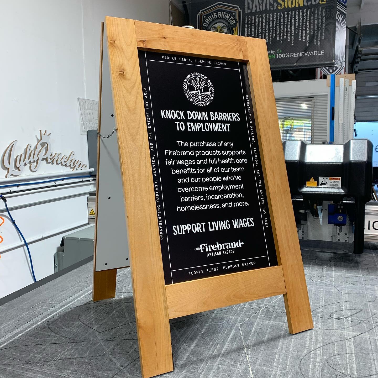 Custom Sidewalk Sign for @firebrandartisanbreads Aluminum printed graphics + Wood A frame + Marine grade varnish. #aframe #sidewalksign #display #bread #firebrands #woodsign #frame #hinge #wood #uvprinting #supportlivingwages #knockdownbarriers #supp