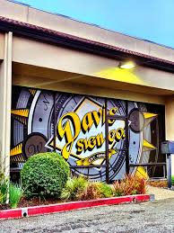 Storefront of Davis Sign Co. located in San Rafael, showcasing custom window decals and professional business signage.
