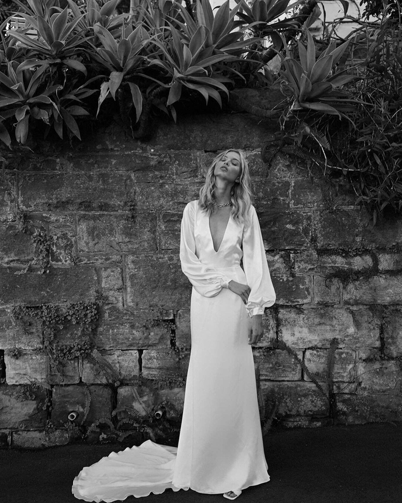 Introducing Coco by And For Love, a masterpiece. With billowing poet sleeves, a fit to flare skirt, and an open neckline in a luxurious buttery silk, this gown is an absolute show stopper. ✨ 

#CocoByAndForLove #SummerGardenCollection #BridalBoutique