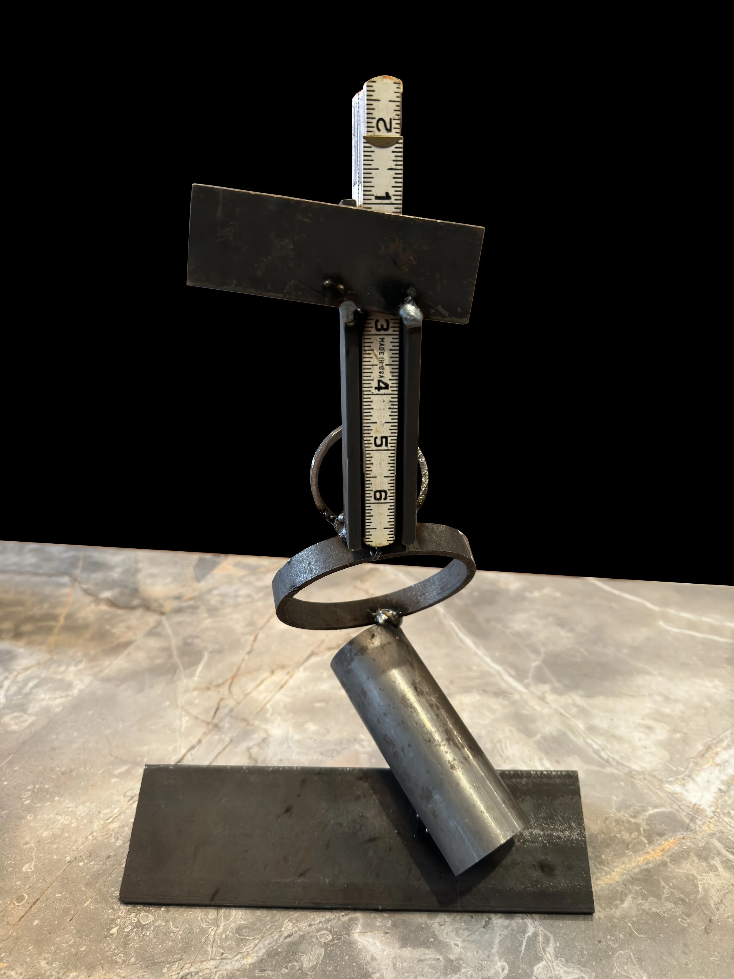 Connection 2 Scrap steel sculpture with Dad’s wooden ruler by Julie Eisenberg Pitman