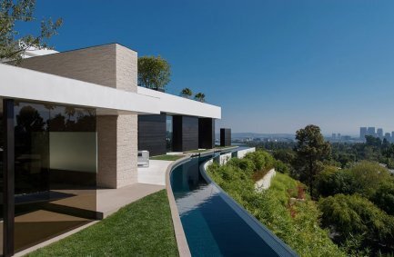 Modern luxury Laurel Way Beverly Hills mansion with wraparound moat pool river and hillside views