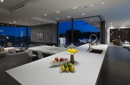 Benedict Canyon Beverly Hills open plan modern home kitchen with center island and pool views
