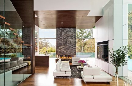 Summit House Beverly Hills modern home living room interior with double height energy efficient glass walls