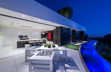 Indoor outdoor kitchen and terrace dining at our modern Beverly Hills mansion Laurel Way