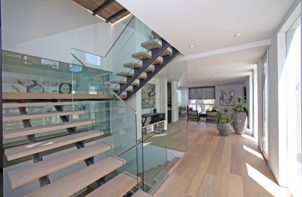 Glass enclosed switchback staircase at our Grand View Drive house in the Hollywood Hills