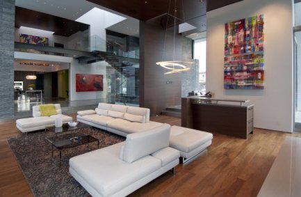 The luxury living room at our Summit House in Beverly Hills features modern art and an open plan design