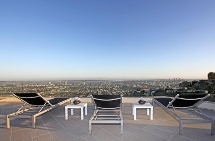 Roof deck terrace lounge with expansive city views at our Grand View Drive house in the Hollywood Hills