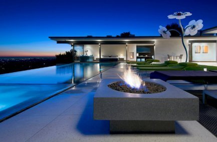 Hopen Place house, a sleek, luxury mid-century modern Hollywood Hills home with hilltop infinity pool, contemporary fire pit, and views