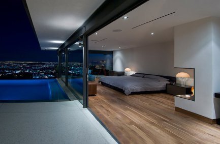 Hopen Place Hollywood Hills modern home luxury poolside bedroom design with sleek floor to ceiling glass walls and city views