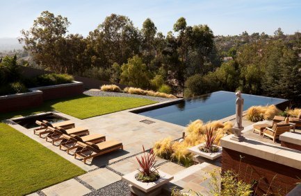 Canyon side infinity pool backyard terrace at our Prairie style Buckskin Drive house in California