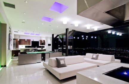 Sleek, modern open plan kitchen and living room design at our Harold Way house in the Hollywood Hills