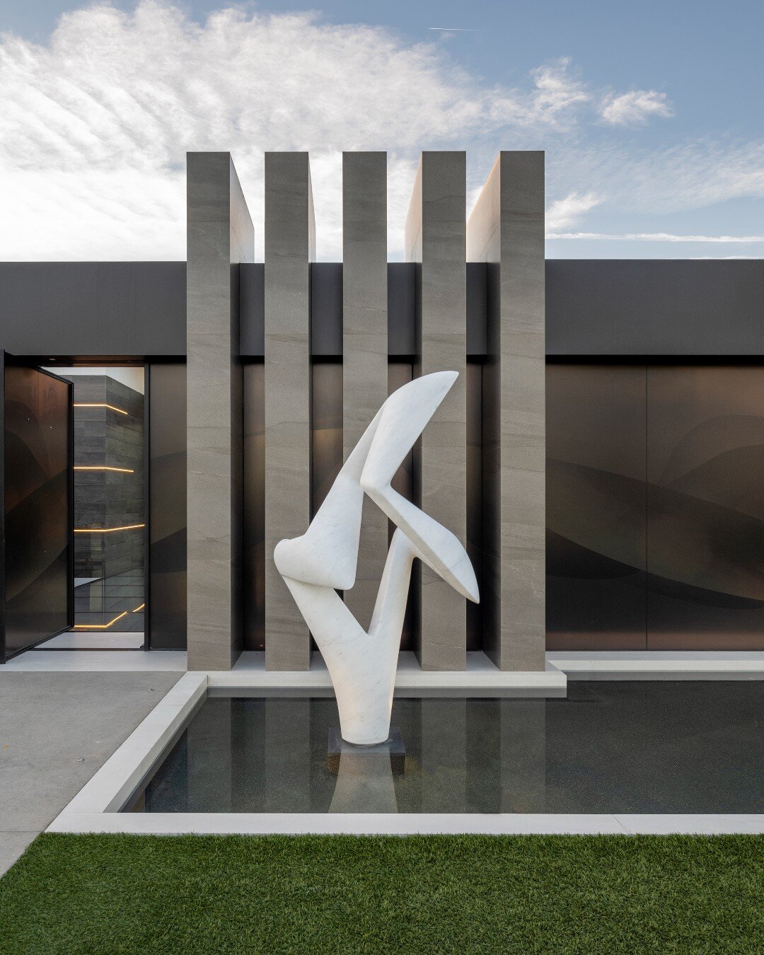 Modern architecture complemented by art, at our Serenity House in Indian Wells. Sculpture by @richard_erdman, photo by @maccollum