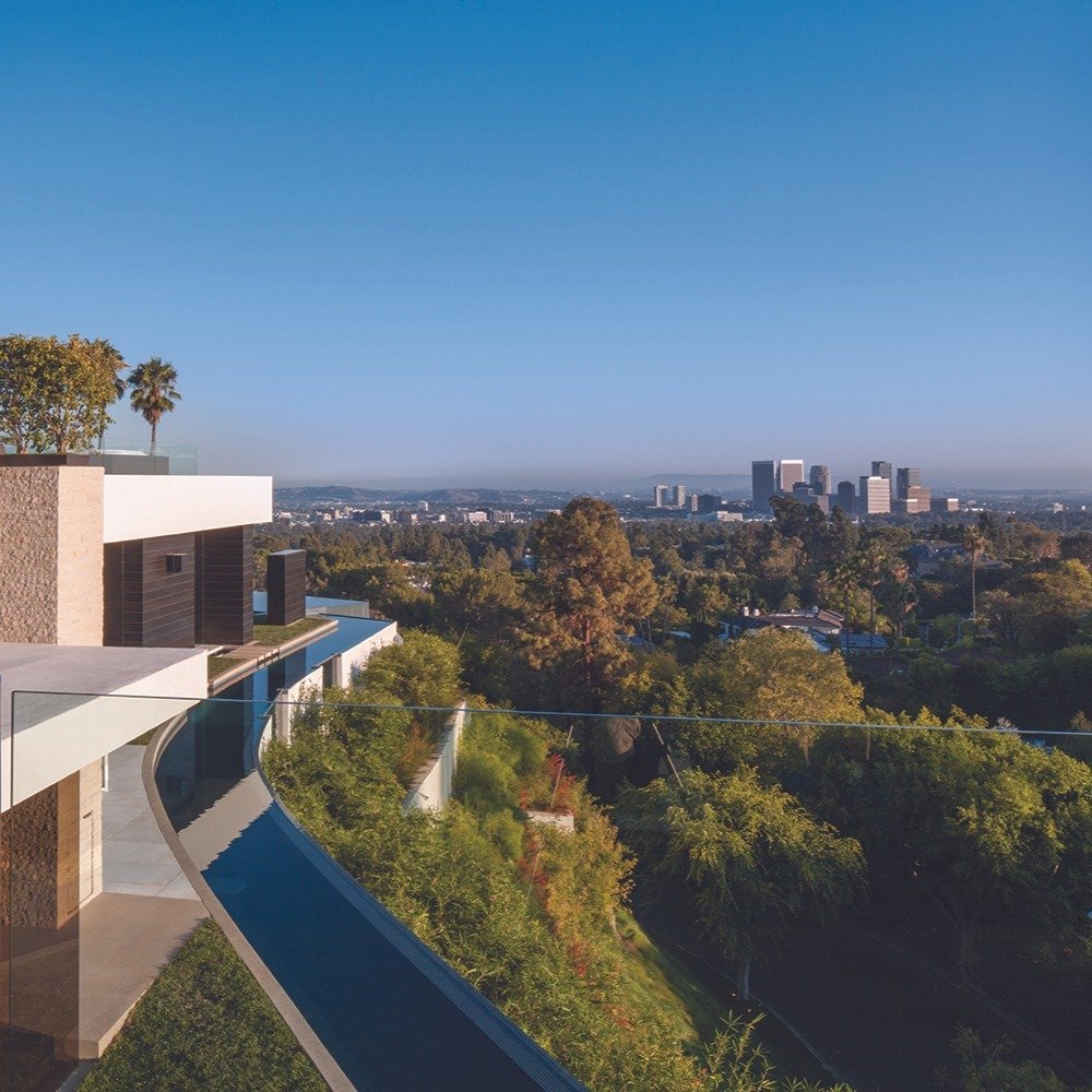 Laurel Way, a modern mansion high up in Beverly Hills, wrapped in water and views.