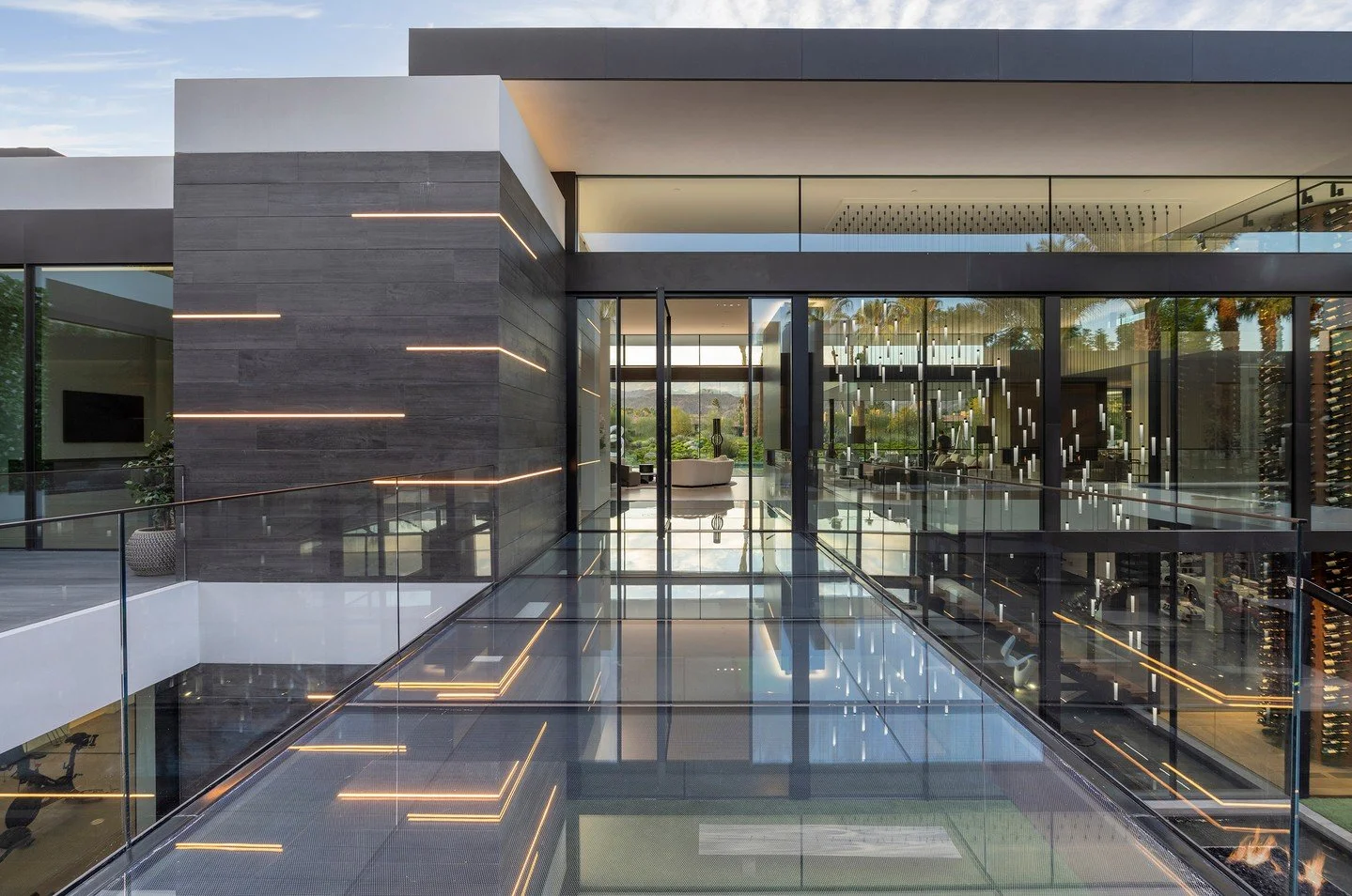 Glass walls, a glass bridge walkway, indoor outdoor design, and LED accent lights give our Serenity house a bright and spacious feeling. Photo by @maccollum