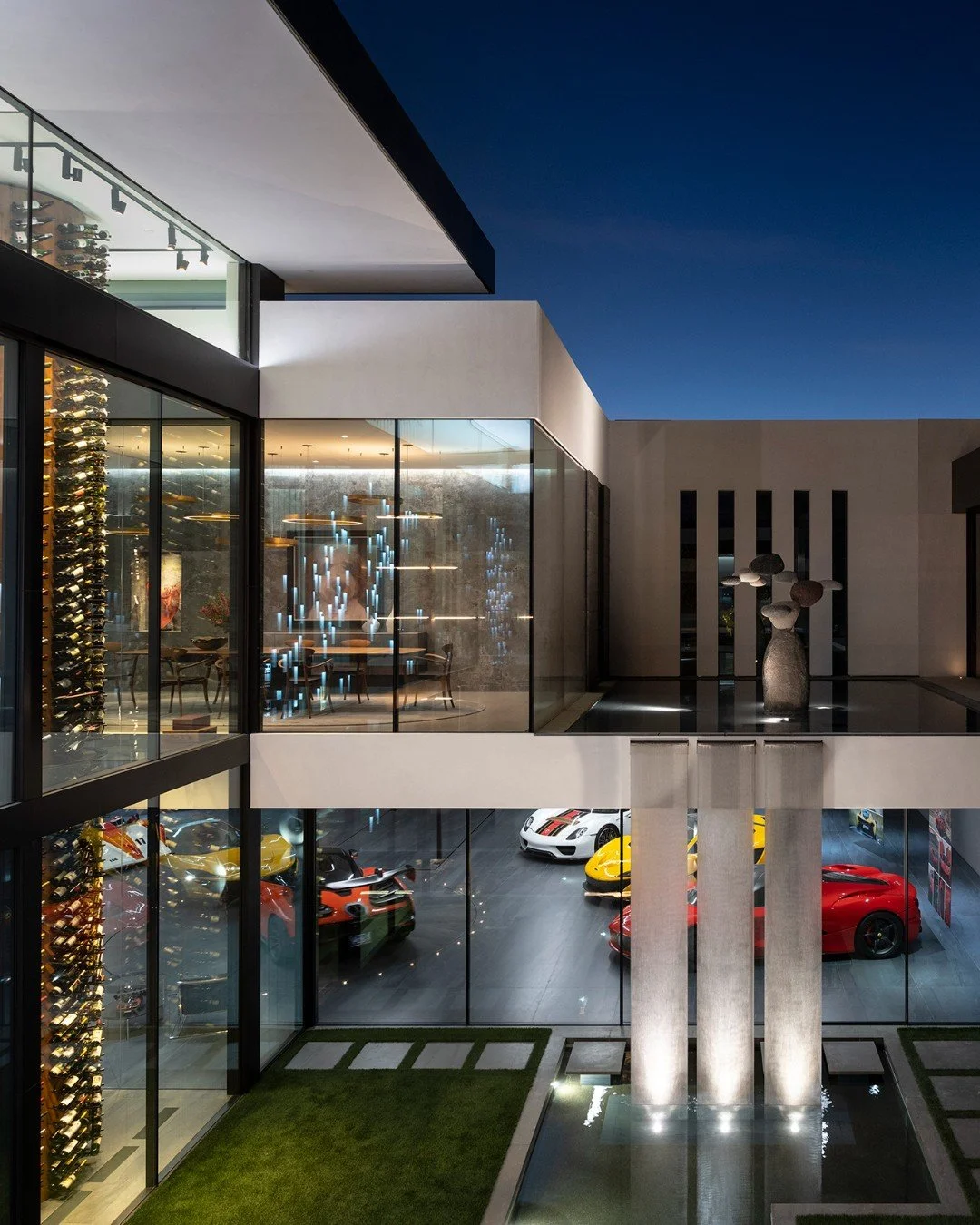 Serenity's modern architectural design incorporates floating glass walls, water features, and luxury indoor outdoor living spaces. Photo by @maccollum