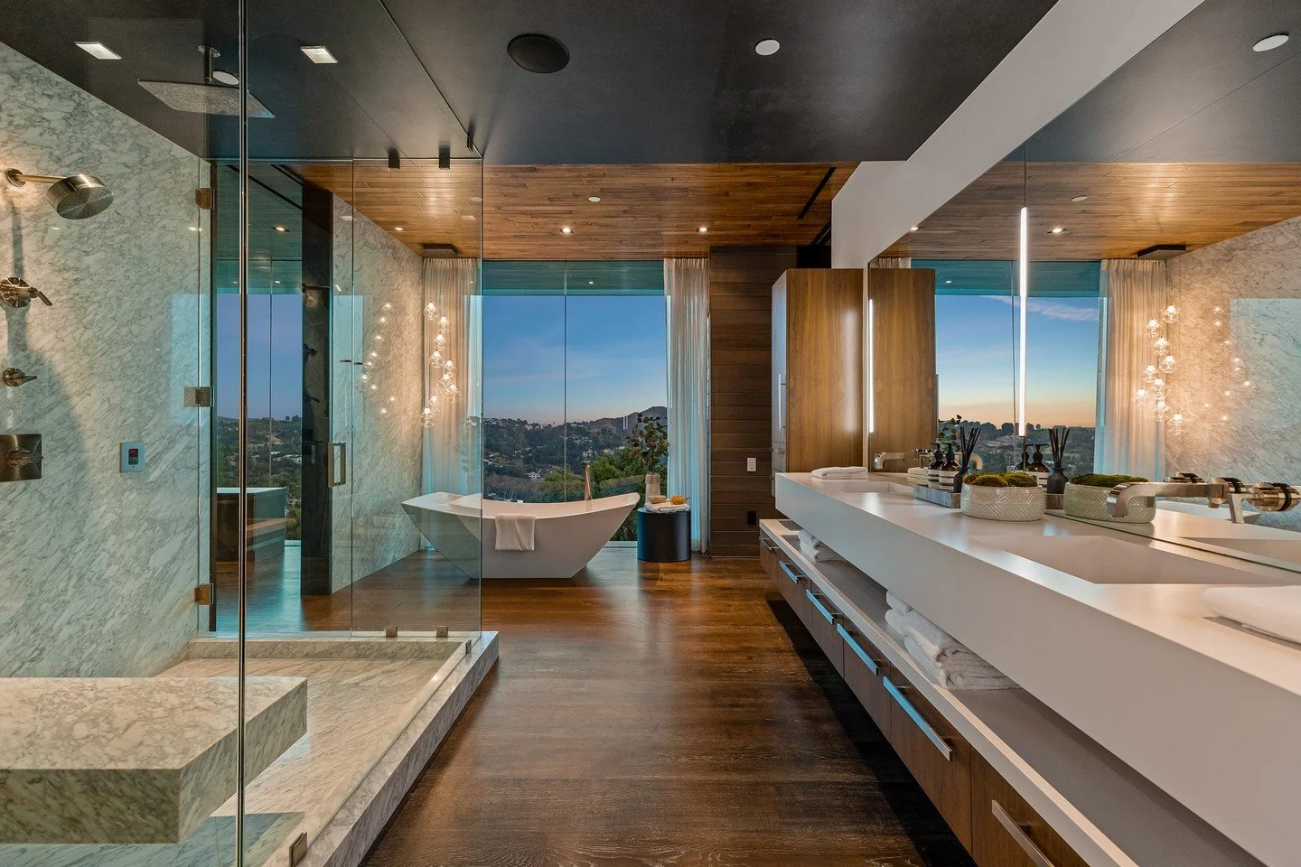 The luxury primary bathroom with modern soaking tub and views at our Benedict Canyon 2023 house in Beverly Hills. Photo by @mrbarcelo