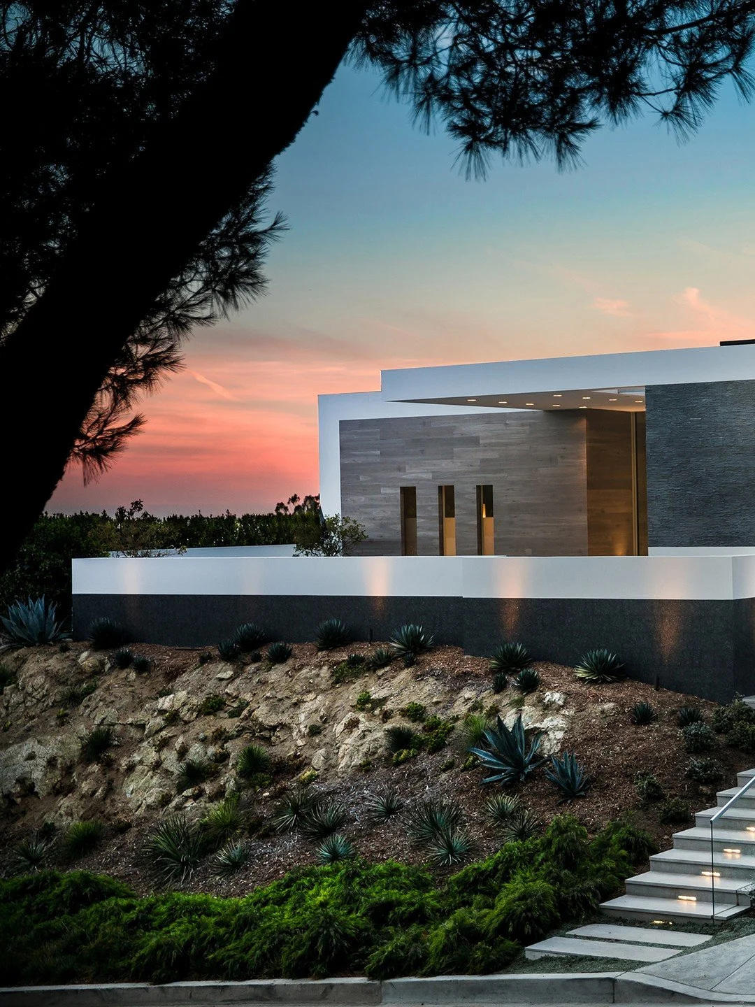 The use of warm materials and natural textures makes our Trousdale House feel like a modern extension of the surrounding terrain. Photo by @jasonspethphoto