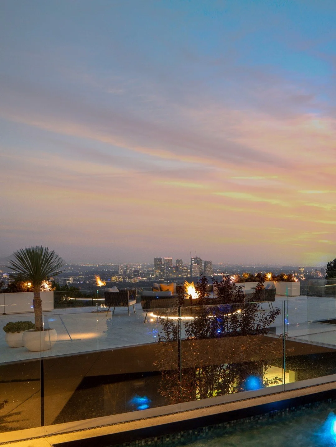 Fire and water features create a luxury outdoor living space at our Summitridge Drive house in Beverly Hills. Photo by @mrbarcelo