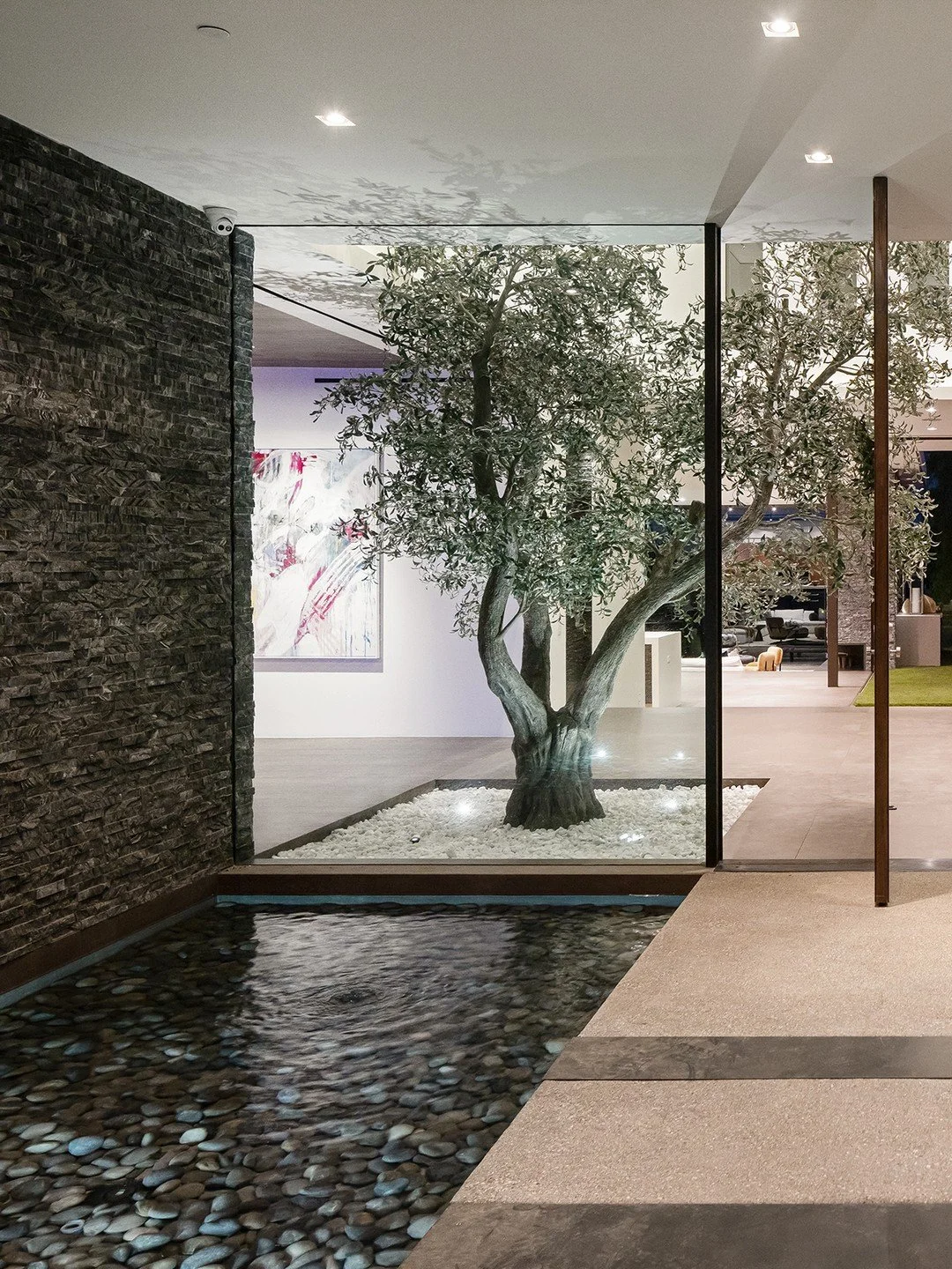 Modern design and natural elements meet at the custom entrance to our Benedict Canyon 2023 house in Beverly Hills. Photo by @mrbarcelo