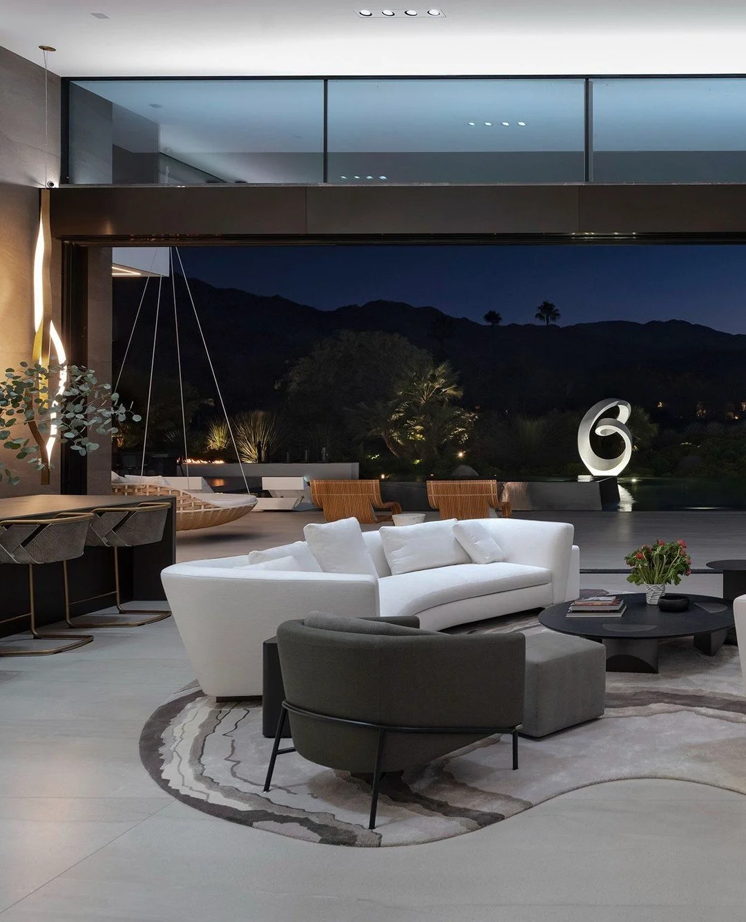 Modern design details, furniture, and decor in the indoor outdoor luxury living room at our Serenity house in Indian Wells, California. Photo by @maccollum