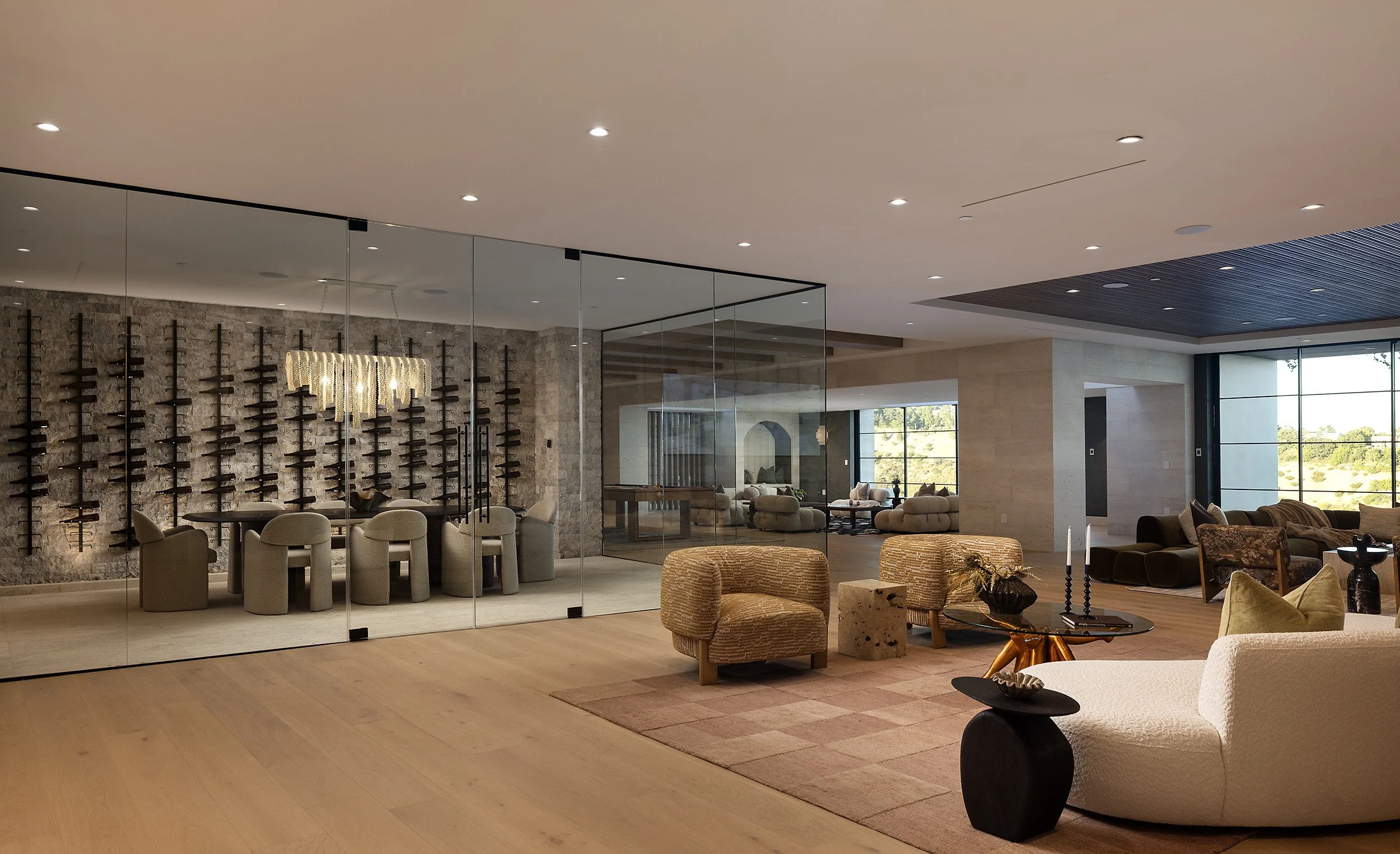 Laurel House Beverly Hills modern home with luxury glass wall wine cellar with dining and gathering spaces