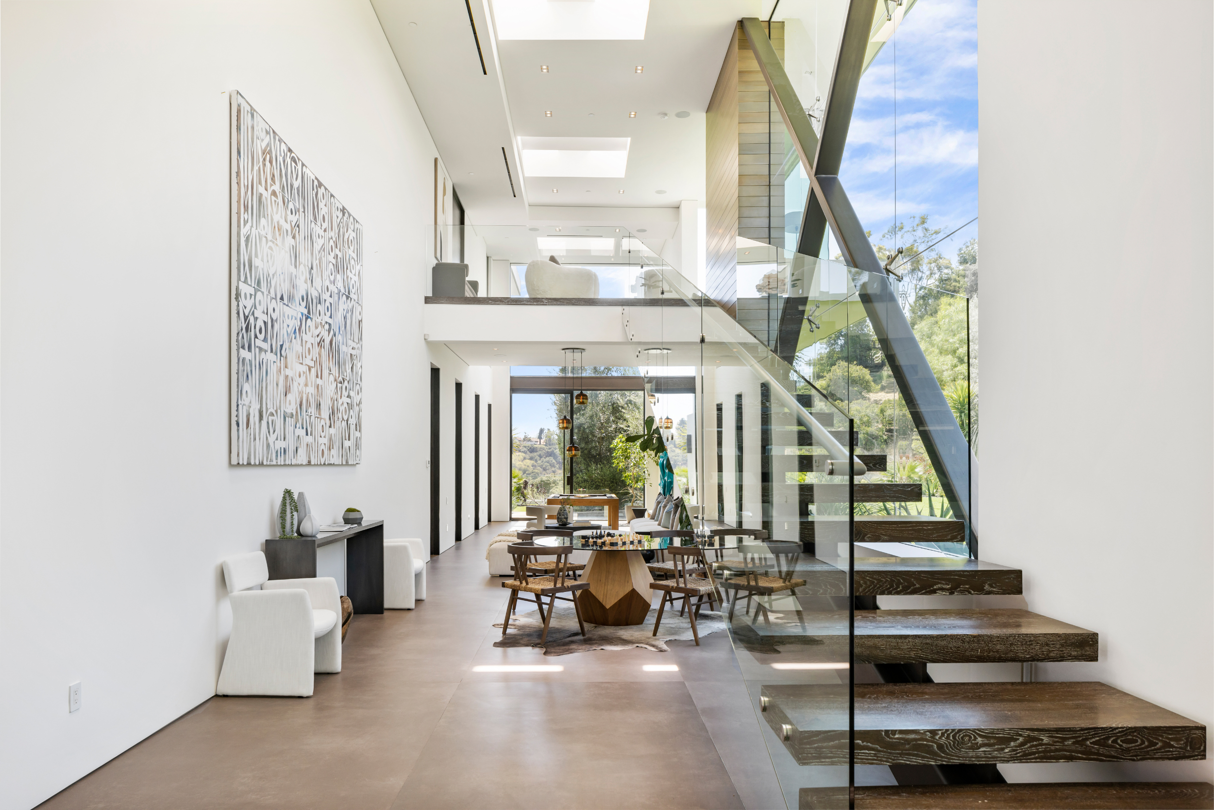 Benedict Canyon 2023 luxury Beverly Hills home light filled atrium with chess table.png