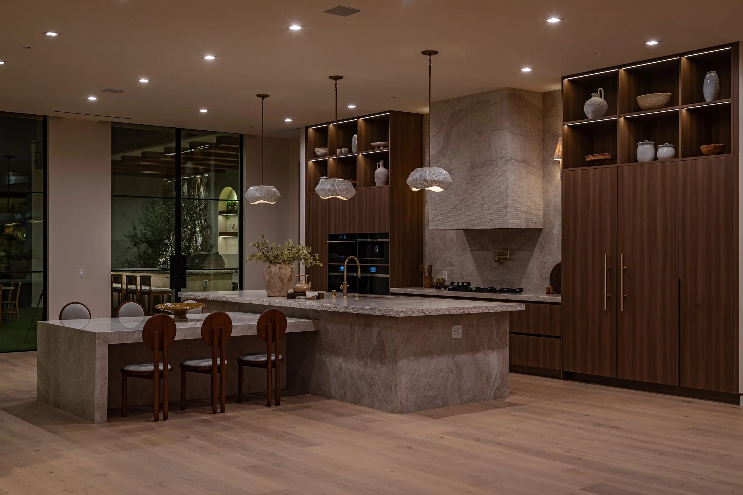Franklin Canyon Beverly Hills luxury home modern open plan kitchen & dining space at night