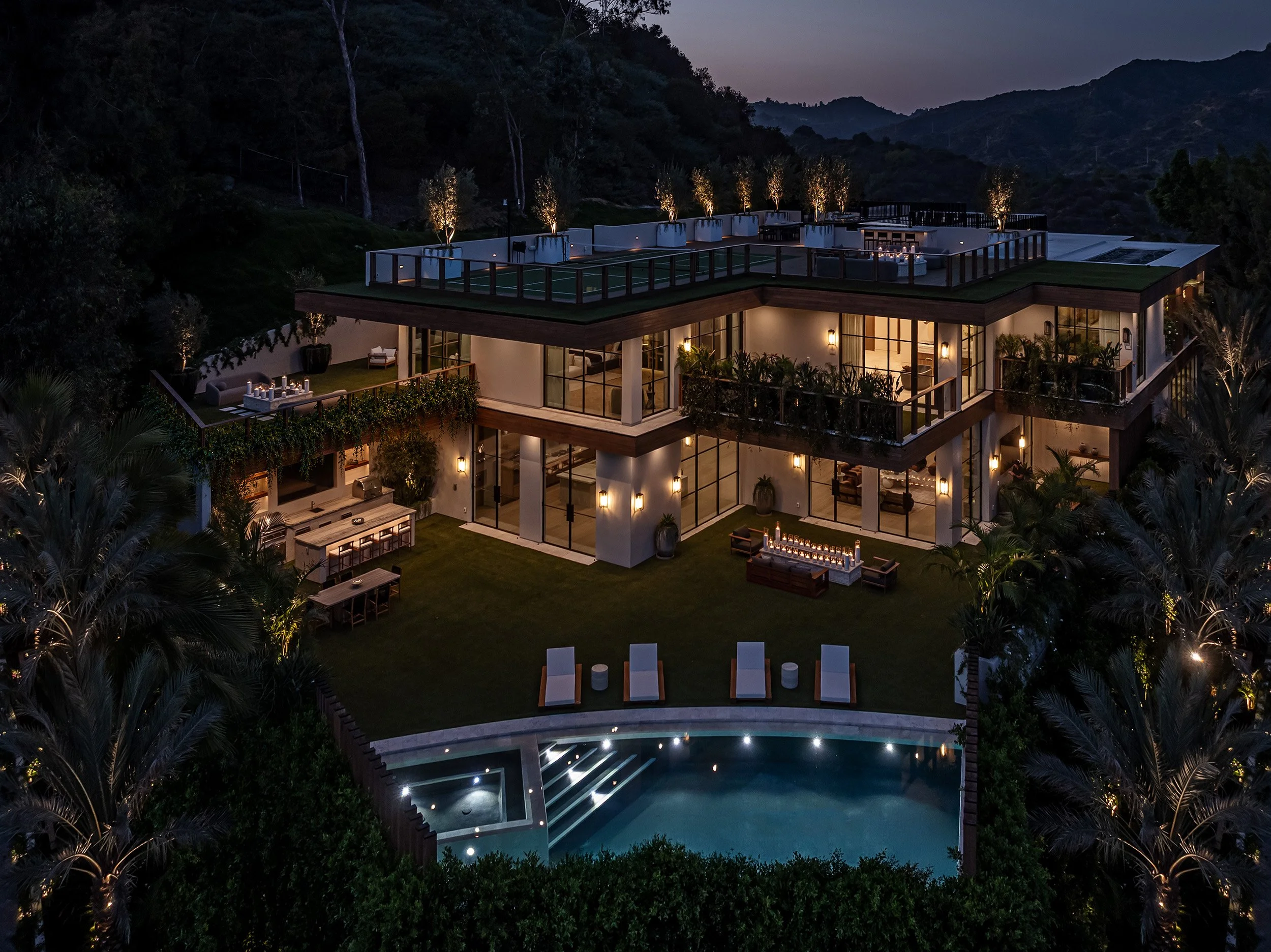 Franklin Canyon Beverly Hills luxury mansion with modern indoor outdoor resort style design & backyard swimming pool 